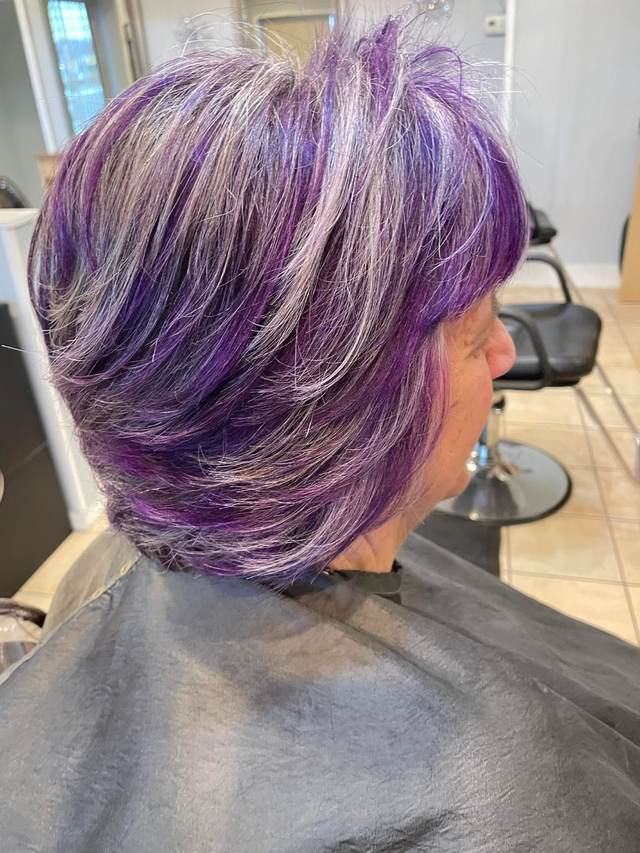 Short layered cut with violet and silver color